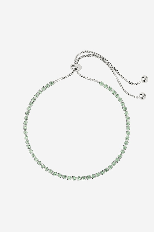 Браслет с зелеными камнями на затяжке